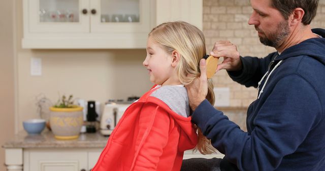 Father Combing Daughter's Hair in Cozy Home Kitchen - Download Free Stock Images Pikwizard.com