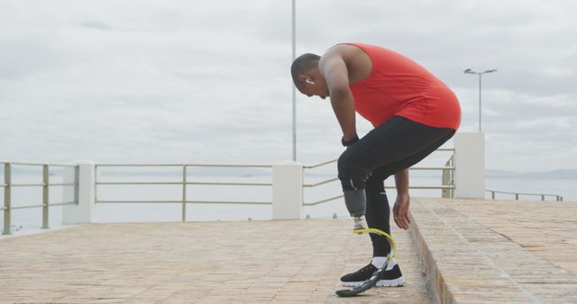 Determined Athlete Adjusting Prosthetic Leg During Outdoor Exercise - Download Free Stock Images Pikwizard.com