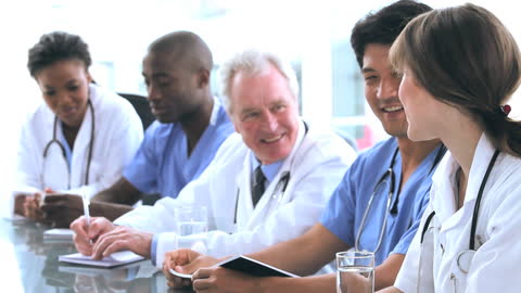 Diverse Medical Team Collaborating in Office Meeting