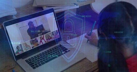 Student writing during secure online class with shield overlay for data protection