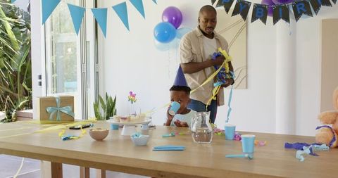 Father and Son Decorating Table for Birthday Celebration
