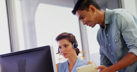 Two Professionals Collaborating in Modern Office Environment - Download Free Stock Images Pikwizard.com