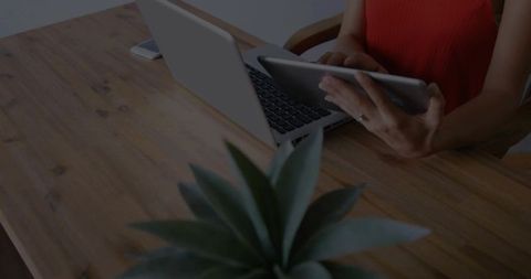 Woman Using Digital Devices at Wooden Desk Modern Minimalist Workspace