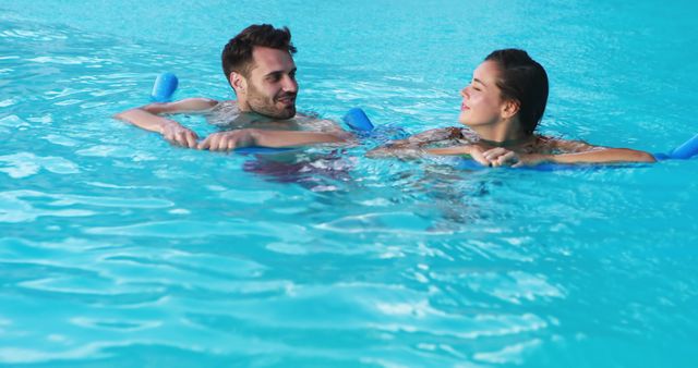 Happy Couple Relaxing on Pool Floats in Blue Swimming Pool - Download Free Stock Images Pikwizard.com