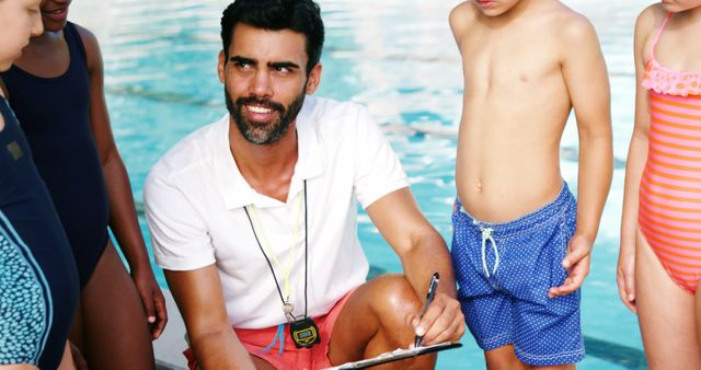 Swimming Coach Instructing Young Swimmers by Poolside - Download Free Stock Images Pikwizard.com