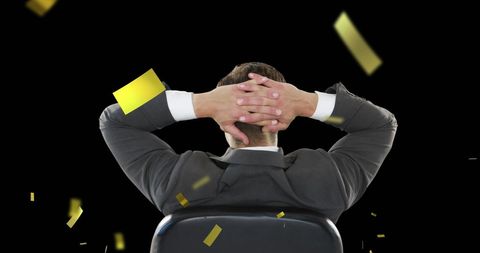 Confident Businessman Relaxing as Gold Confetti Falls - Download Free Stock Images Pikwizard.com