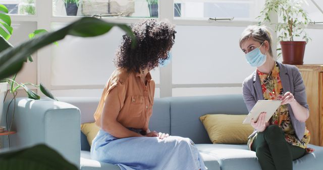 Counselor and client discuss report during session in modern office - Download Free Stock Images Pikwizard.com