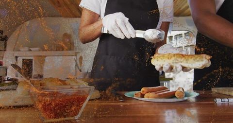 Artisanal Hot Dog Preparation in Cozy Cafe Kitchen