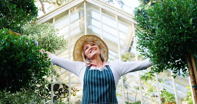 Happy Senior Woman Gardening in Greenhouse - Download Free Stock Images Pikwizard.com