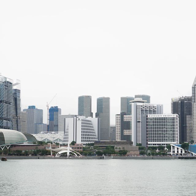 Modern Singapore Waterfront Skyline with Skyscrapers on Overcast Day - Download Free Stock Images Pikwizard.com