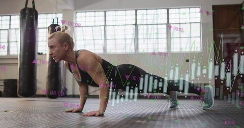 Female athlete performing push-up plank with fitness data overlay and analytics charts