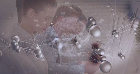 Innovative Scientists Analyzing Molecular Models Collaboratively