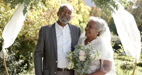 Senior Couple Celebrating Wedding in Sunny Garden