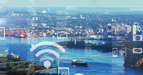 Smart port connectivity over coastal city with green suspension bridge and cargo vessel