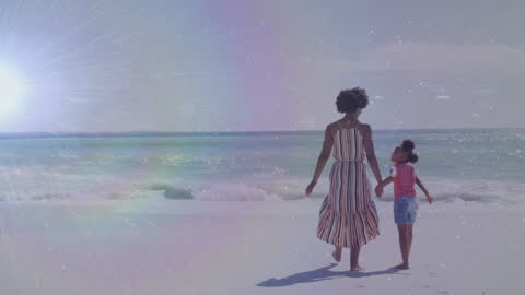 Mother and Daughter Enjoying a Sunny Walk on the Beach