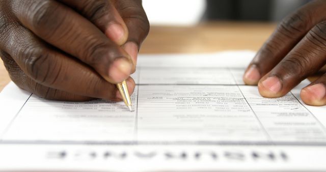 Closeup of Hands Filling out Insurance Form with Pen - Download Free Stock Images Pikwizard.com