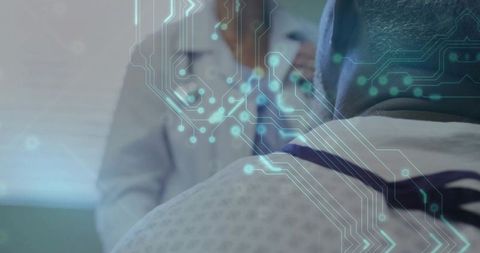 Patient receiving clinical consultation while digital circuitry overlay conveys health data