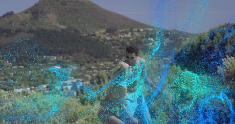 Couple Enjoying Scenic Landscape with Digital Light Effects