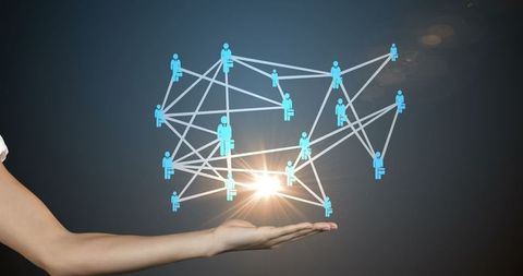 Hand holding digital network representing global communication