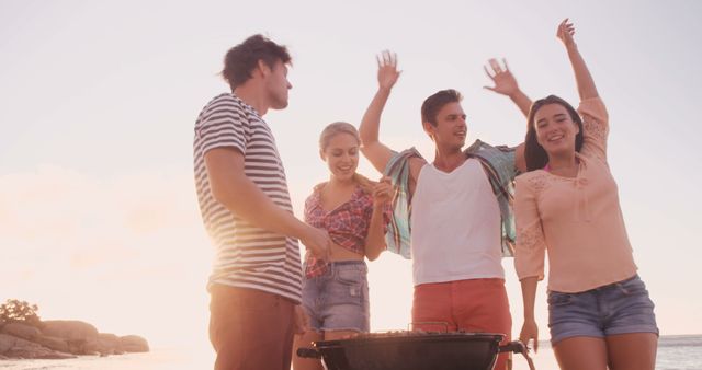 Friends Barbecuing and Celebrating at Beach Party at Sunset - Download Free Stock Images Pikwizard.com