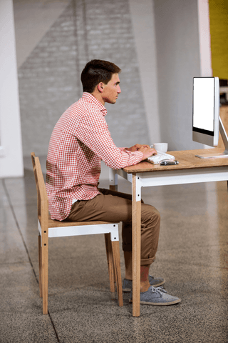 transparent workflow behind desk with focused young man on computer - Download Free Stock Videos Pikwizard.com