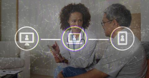 Consultant guiding client with technology overlay in modern lounge