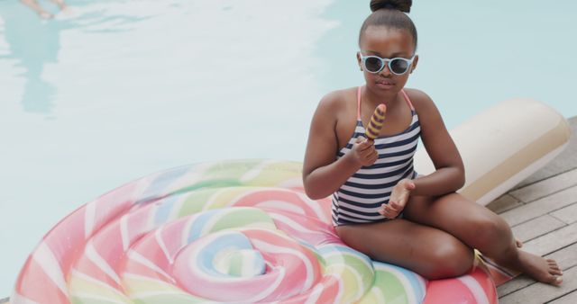 Child Enjoying Ice Cream by Swimming Pool on Bright Summer Day - Download Free Stock Images Pikwizard.com