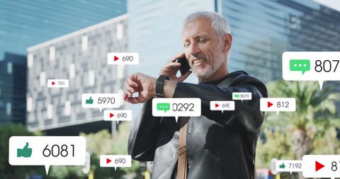 Senior Man Engaging with Social Media Notifications Amid Urban Setting