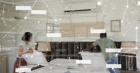 Couple making hotel bed in modern minimalist bedroom with digital network overlay