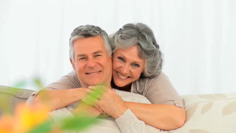 Joyful Elderly Couple Relaxing at Home