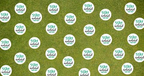 Stay Natural Rings on Green Grass Background