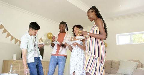 Diverse Friends Enjoying Dessert and Togetherness at Home Party