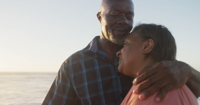 Elderly Couple Embracing During Sunset on Beach - Download Free Stock Images Pikwizard.com