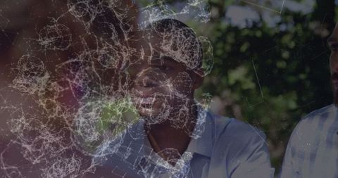 Multiracial Business Team Meeting Against Abstract Digital Overlay