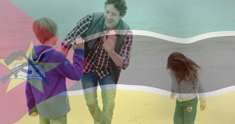 Father Bonding with Children at Mozambique Beach During Sunset