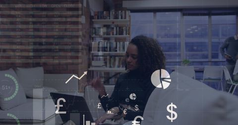 Biracial Businesswoman Analyzing Financial Data in Modern Office Setting