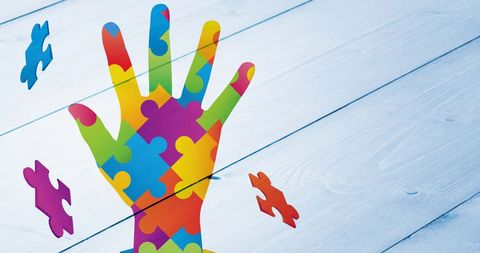 Hand Symbol Made of Colorful Puzzle Pieces on Blue Wood Texture - Download Free Stock Images Pikwizard.com