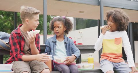 Diverse Schoolchildren Enjoying Anxiety-Free Schoolyard Lunch - Download Free Stock Images Pikwizard.com
