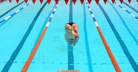 Male Athlete Diving Into Competition Pool with Perfect Form - Download Free Stock Images Pikwizard.com