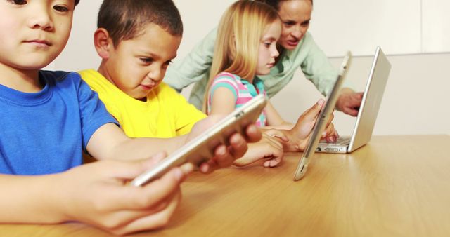 Children Learning with Digital Devices in Classroom - Download Free Stock Photos Pikwizard.com