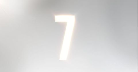 Glowing Number Seven on Soft Light Grey Background - Download Free Stock Images Pikwizard.com