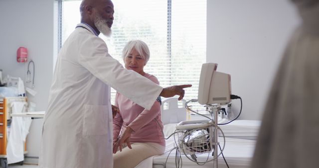 Senior Woman Receiving Doctor's Consultation in Modern Clinic - Download Free Stock Images Pikwizard.com