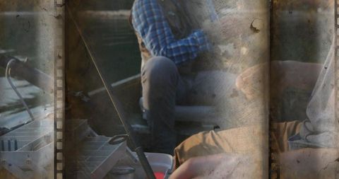 Two anglers fishing in small boat handling tackle box with vintage filmstrip overlay