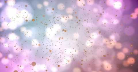 Shimmering pastel bokeh with floating gold specks and soft halos