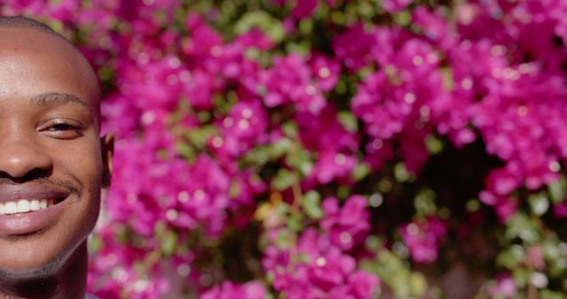 Smiling Young Man with Floral Background - Download Free Stock Images Pikwizard.com