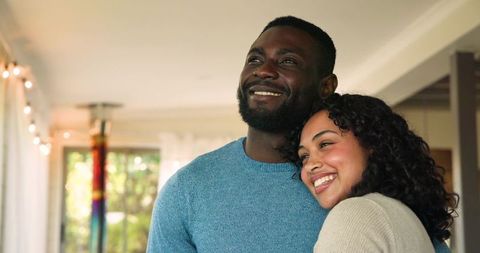 Affectionate Couple Embracing in Cozy Living Room
