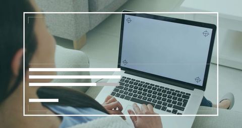 Woman Typing on Laptop in Minimalist Living Space