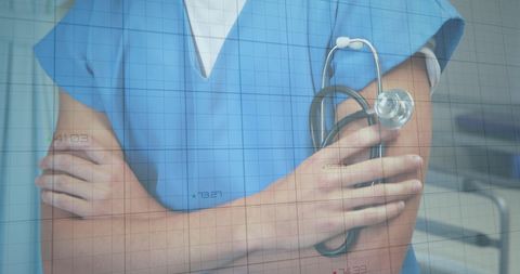 Healthcare Professional in Blue Scrubs With Stethoscope in Hospital