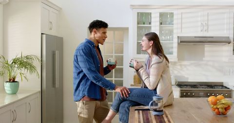 Couple Enjoying Coffee Together in Modern Kitchen Atmosphere