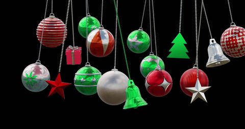 Festive hanging christmas baubles and decorations on black background